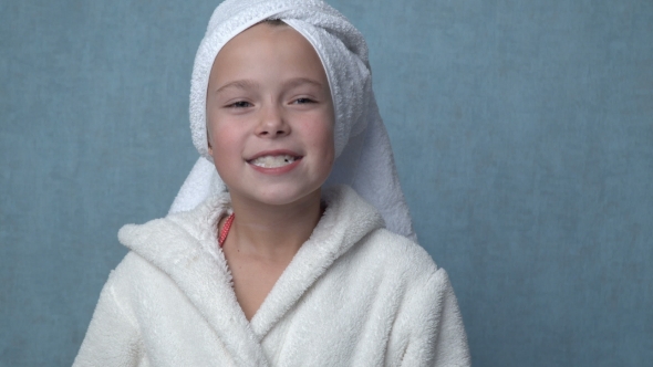 Girl Cleaning Teeth With Electric Toothbrush alt