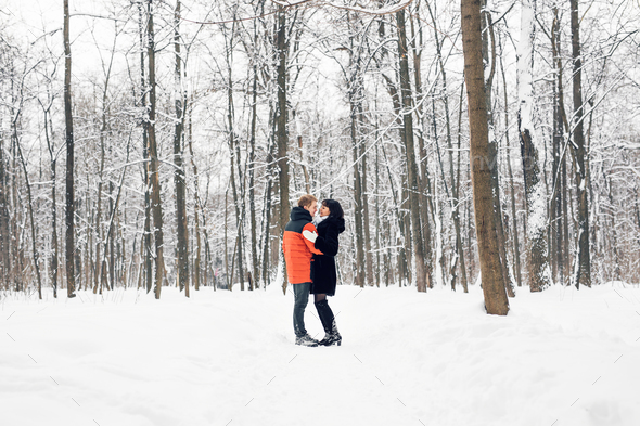 Winter in City Park. Couple in winter park. - Stock Photo - Images