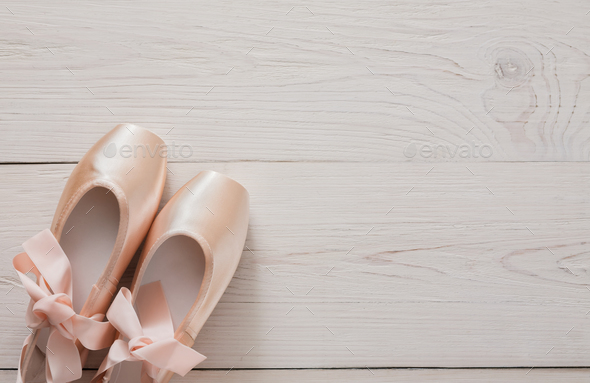 Pink ballet pointe shoes on white wood background Stock Photo by ...
