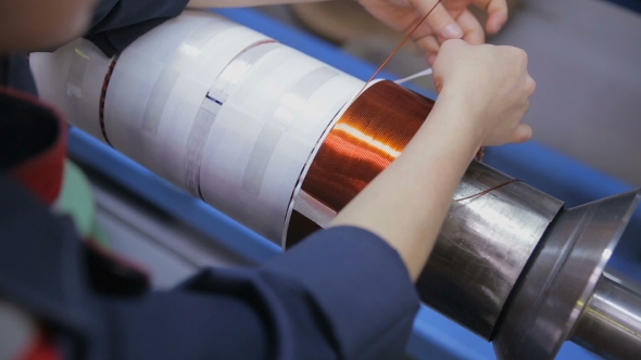 Worker Operates With Electric Cooper Wires alt