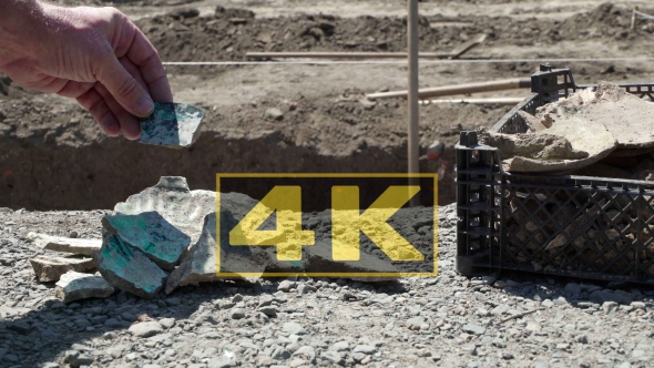 Archaeologist Shows And Places Ancient Shards Of Bowls. Concept Ages And Time alt