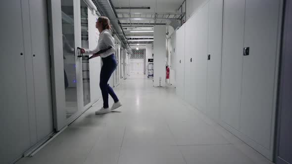 Woman entering to server room alt