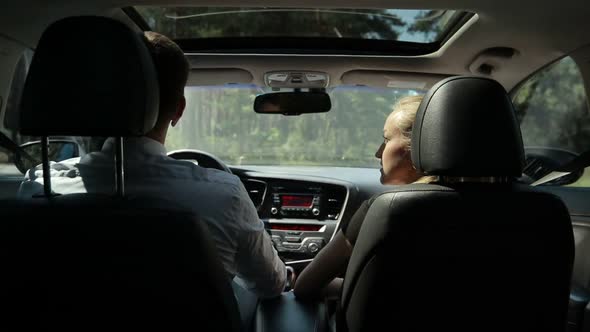 Business Colleagues Going on Business Trip By Car alt