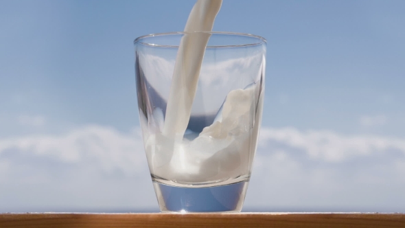 Cookies And Glass Of Milk, On Wooden Table.