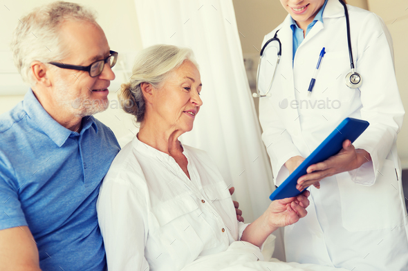 senior woman and doctor with tablet pc at hospital - Stock Photo - Images
