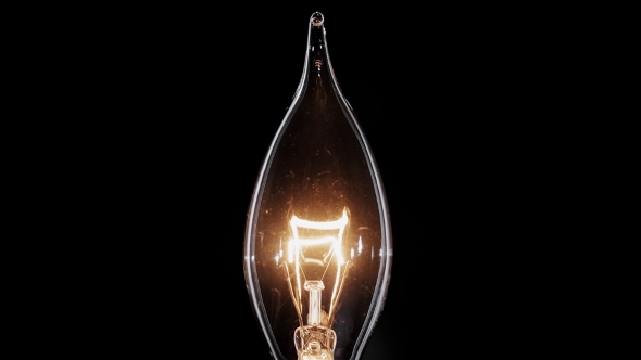 Candle Shaped Edison Lamp Flickers Over Black Background,  View