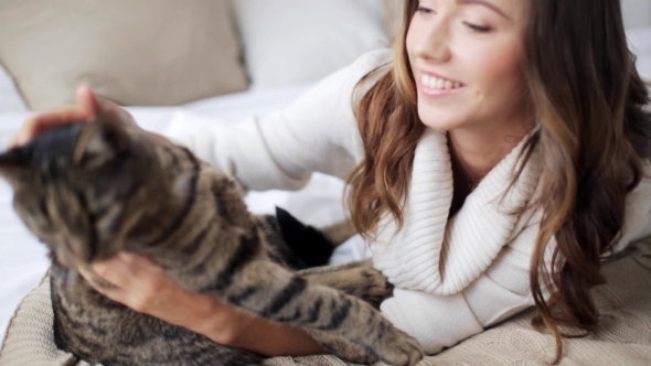 Happy Young Woman With Cat In Bed At Home 13, Stock Footage | VideoHive