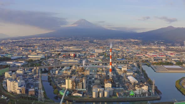 Aerial view of Mountain Fuji near industrial area, factory near habour in Shizuoka City alt