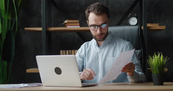Confident Businessman in Eyeglasses Making Conference Video Call on Laptop alt