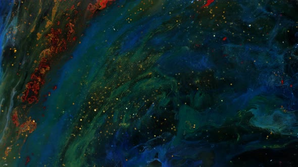 Blue and Green Smoke Spreads in Veins on a Golden Shimmering Background alt