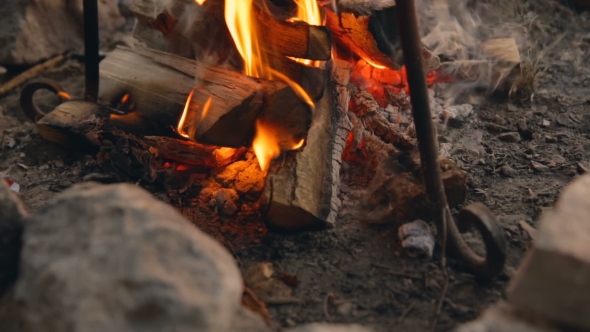 Cooking On Fire At Sunset. Cooking On Fire. Travel Gear. The Tourist Pot On Fire.