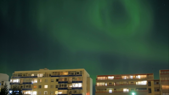 Aurora Borealis Over Living Houses In Reykjavik, Iceland,