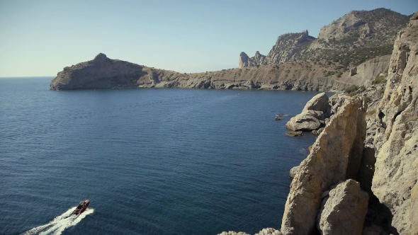 Boat Sailing In The Blue Bay In a Novy Svet In The Crimea