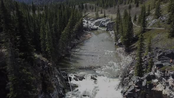 Aerial Footage Of Creek Bank Cliffs & Waterfalls