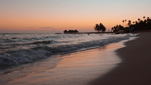 Ocean Waves Rolling At The Tropical Beach At Sunset. - static alt