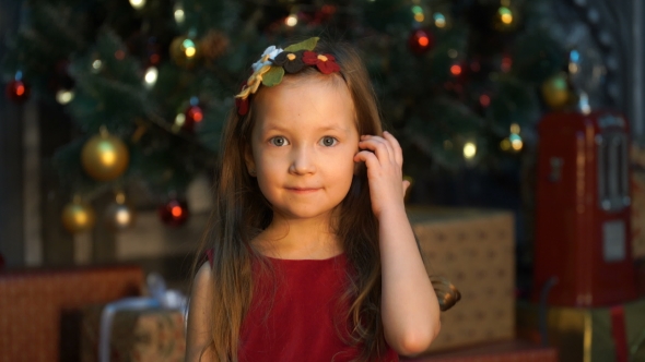 Footage Girl Standing Near The Christmas Tree., Stock Footage | VideoHive