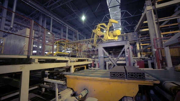 Industrial Robot. Robotic Arm Assembling Products On A Modern Plant. alt