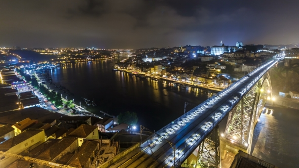 Night View Of The Historic City Of Porto, Portugal  With The Dom Luiz Bridge alt