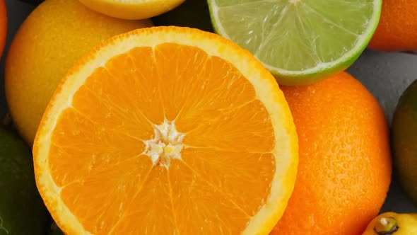 Sliced Juicy Orange, Lime and Limon on Citrus Fruit Background, Medicine and Food Concept alt