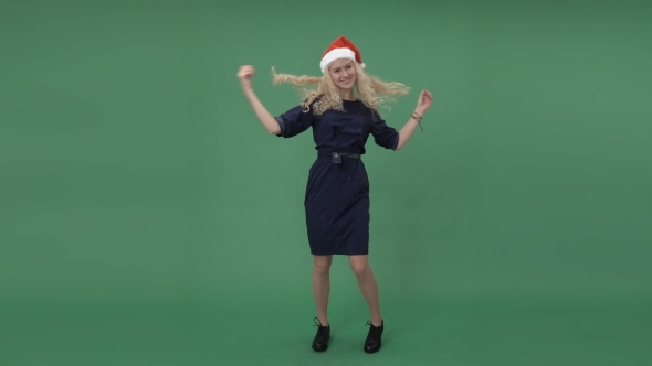 Woman In a Santa's Cap Dancing And Hanging Out alt