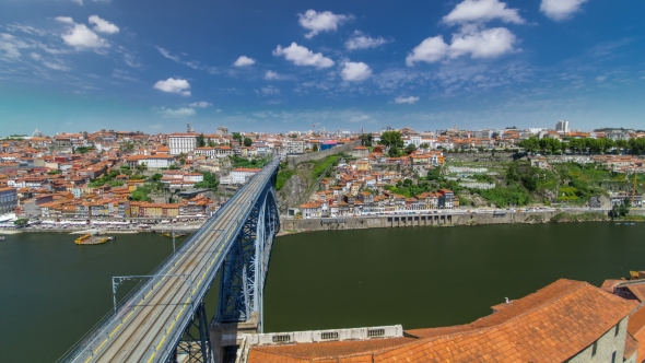 View Of The Historic City Of Porto, Portugal With The Dom Luiz Bridge . A Metro Train Can Be Seen On alt