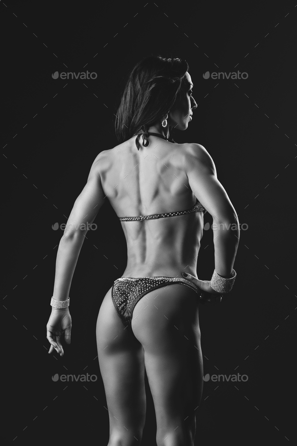 Sporty girl back with muscles Stock Photo by Svetography