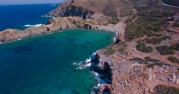 Blue Sea, Waves Breaking In Cliffs At Shore