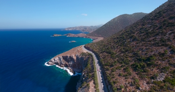 Flying Above Road By Seashore