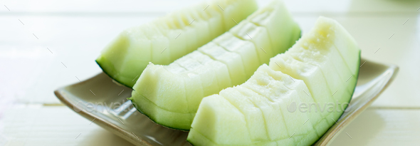 Juicy slice melon on plate - Stock Photo - Images