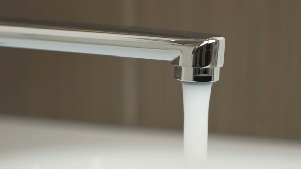 Water Under Strong Pressure Flows From a Water Tap