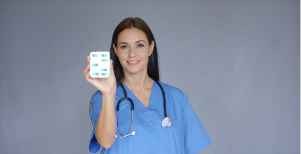 Doctor With Stethoscope Holding Package alt