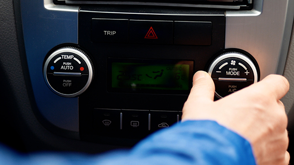 Car Interior, Man Hand Using Automobile Air Conditioning System alt