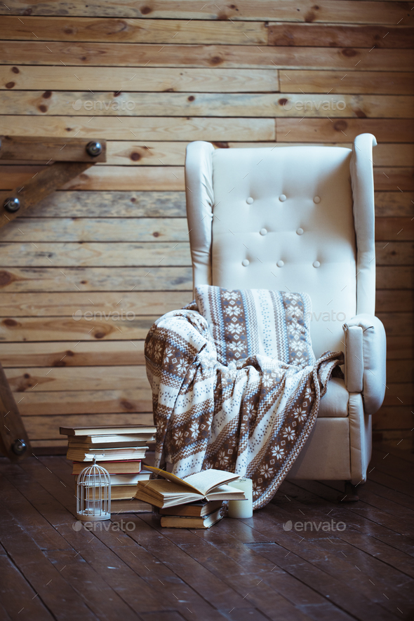 Stack of books with warm plaid on chair - Stock Photo - Images