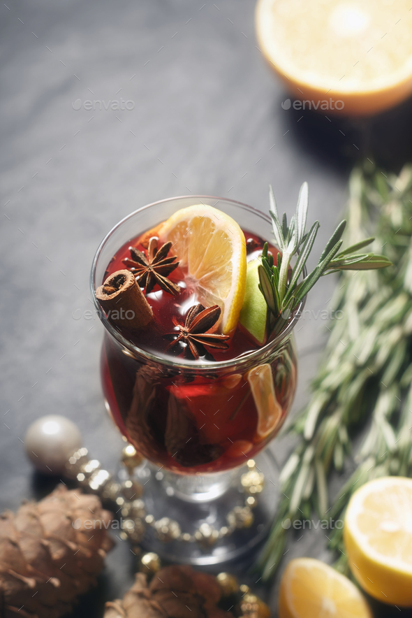 Mulled wine with different spices vertical