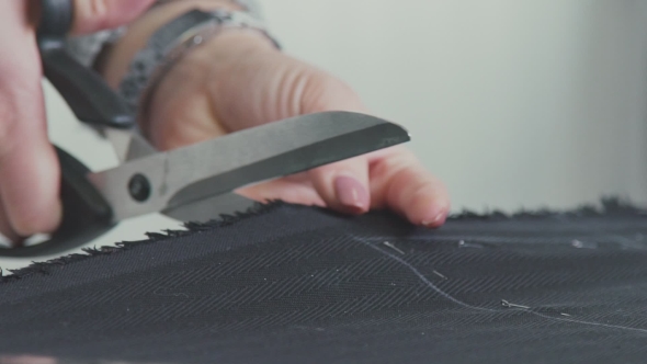Cutting Fabric. Сut Out Of a Fabric For Clothing In a Design Studio.