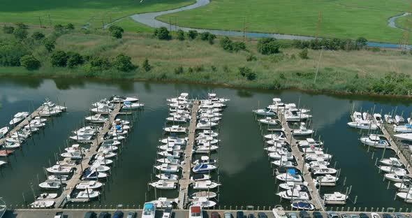 Aerial view boats in little port in ocean a little marina along the dockside alt