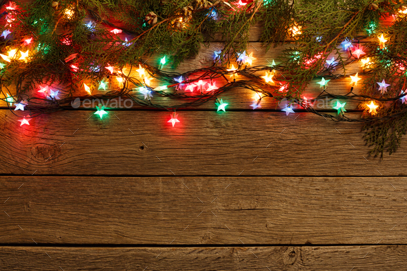 christmas lights border on wood background Stock Photo by Prostock-studio
