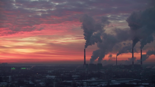 Air Pollution. Power Plant at Sunset