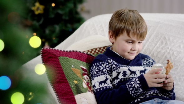 Teen Shaking Snow Globe, Stock Footage | VideoHive