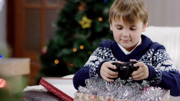 Young Boy Opening Christmas Presents