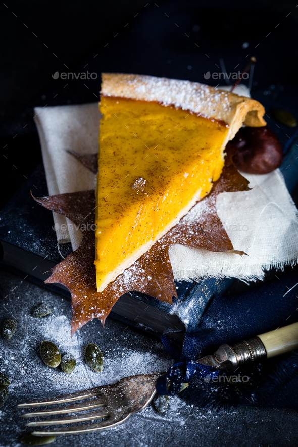 A Slice of Thanksgiving Pumpkin Pie in Autumn Scene - Stock Photo - Images