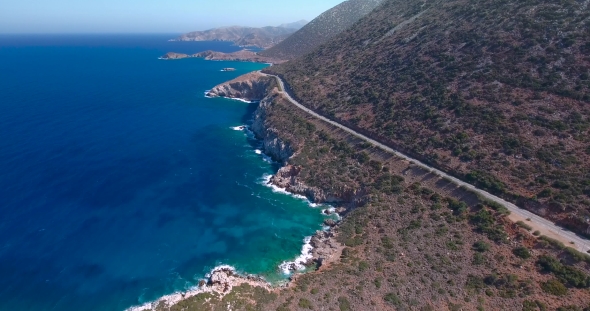 Flying Above Road By Seashore