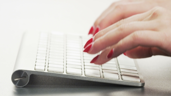 Woman Typing on a Keyboard alt