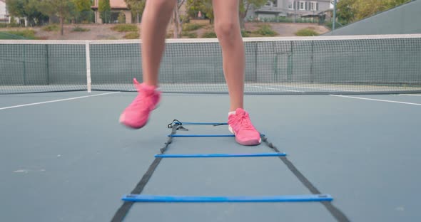 Close Up View of Female Legs Training on the Tennis Court alt