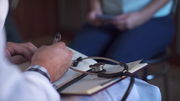 Doctor Taking Blood Pressure To Patient at Home