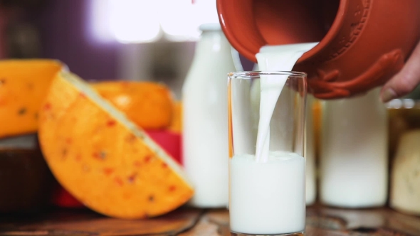 Pour the Milk Into Cup From Jug alt