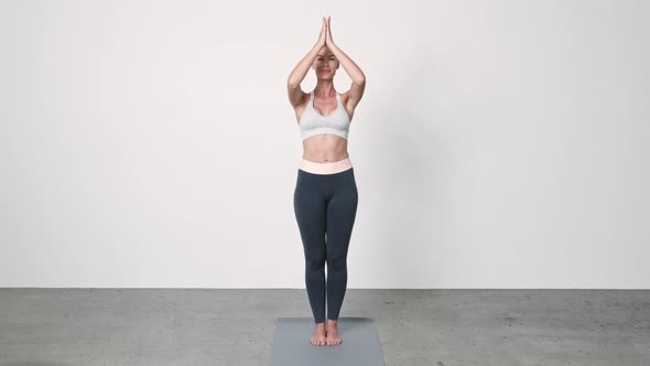 Woman Smiling in Yoga Pose