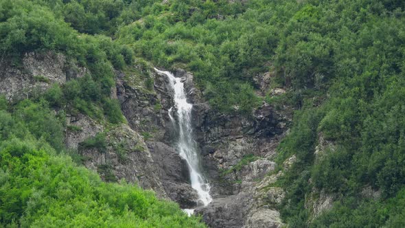 View of Waterfall Scenes in Mountains, National Park Dombay, Caucasus, Russia