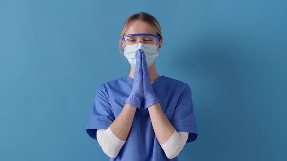 Nurse keeps palms in pray gesture, asks for help. Concept of safety life