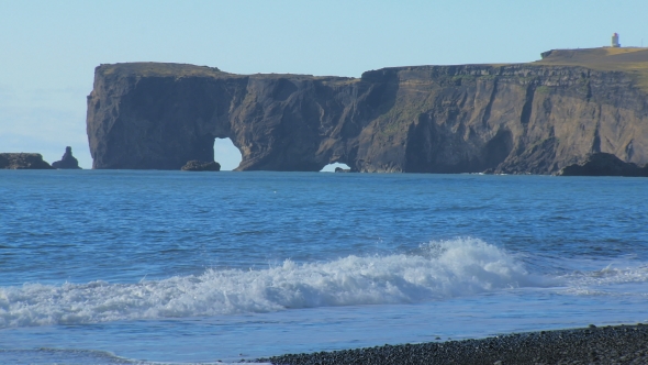 Cape Dyrholaey From Black Sand Beach in Iceland in Sunny Calm Weather